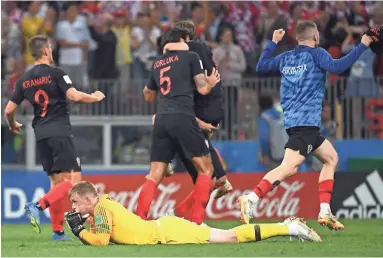  ?? MANAN VATSYAYANA AFP/GETTY IMAGES ?? England’s goalkeeper Jordan Pickford reacts after losing to Croatia in a World Cup semifinal match on Wednesday in Moscow. England led much of the game before allowing the tying goal in the second half.