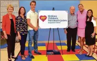  ?? JIM MANDEVILLE / NICKLAUS COS. ?? Barbara Nicklaus (from left), Jean Smith, Colton Smith, Jack Nicklaus, Michelle McGann and Dr. Miladys Palau gather for a photo at the Nicklaus Children’s Palm Beach Gardens Outpatient Center.