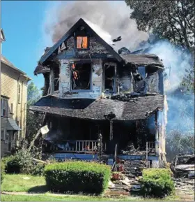  ?? KEVIN MARTIN — THE MORNING JOURNAL ?? Fire destroyed a house and a boy died July 7 on the 400 block of 2nd Street in Elyria.