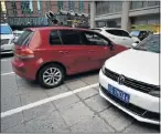  ?? Picture: AFP ?? SAFETY CONCERNS: Volkswagen cars in a parking lot in Beijing