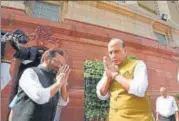  ?? ARVIND YADAV/HT ?? ▪ Union ministers Rajnath Singh and Mukhtar Abbas Naqavi greet each other at Parliament in New Delhi on Friday.