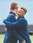  ??  ?? Tom Curran hugs Stuart Broad at the MCG yesterday.