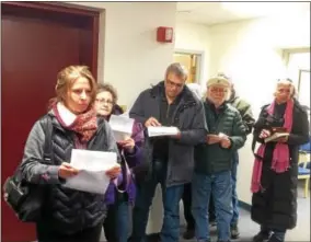  ??  ?? Homeowners wait in line to prepay their 2018 taxes in Clifton Park Town Hall last week.