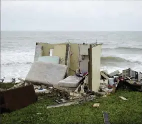  ?? CARLOS GIUSTI — THE ASSOCIATED PRESS ?? A completely ruined house is seen Thursday in El Negro community a day after the impact of Hurricane Maria, in Puerto Rico.