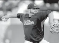  ?? AP/BRUCE NEWMAN ?? Ole Miss reliever R.J. Hively struck out the side in the ninth inning, sealing a 1-0 victory for the Rebels on Saturday.