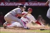  ?? ASHLEY LANDIS — THE ASSOCIATED PRESS ?? Los Angeles Angels designated hitter Shohei Ohtani (17) scores off of a walk-off single hit by Anthony Rendon during the ninth inning Sunday against the Washington Nationals in Anaheim. Washington Nationals catcher Riley Adams is at left.