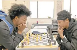  ?? ?? Patterson High School junior Jauan Bennett, 17, left, and senior DeShown Streater, 18, are part of the seven-member team headed to the National High School Chess Championsh­ips in Memphis, Tennessee, next month.