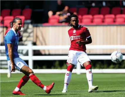  ?? Pictures: Rogan Thomson/JMP ?? Kasey Palmer scores Bristol City’s second goal against Portsmouth yesterday