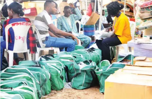  ??  ?? INEC officials arrange electoral materials at the state office yesterday, for upwards distributi­on to various local government areas for the Ekiti State governorsh­ip election NAN