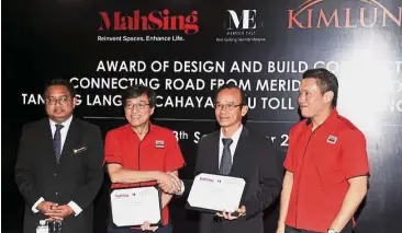  ??  ?? Done deal: Ho (second from left) exchanging documents with Kimlun Group executive director Chin Lian Hing at the signing ceremony. With them are Ong (right) and Pasir Gudang Town Council secretary Saipol Rahmat Amat. — Bernama