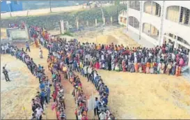  ?? PTI PHOTO ?? People queue up to cast votes for at a polling booth in Agartala on Sunday.