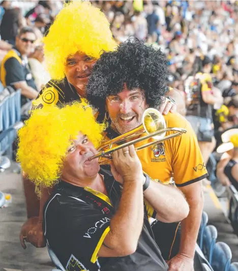  ?? Picture: GLENN CAMPBELL ?? Nightcliff fans (top to bottom) Robin Kidney, Teddy Uunberg and Adrian Kidney cheer on the Tigers