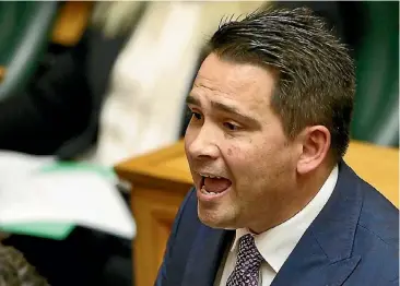  ?? KEVIN STENT, GETTY ?? Finance Minister Grant Robertson, left, delivers his first Budget yesterday, after which Opposition Leader Simon Bridges gave his response.