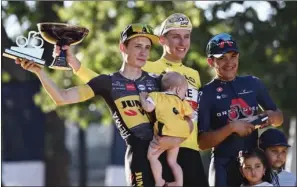  ??  ?? Winner Team UAE Emirates’ Tadej Pogacar of Slovenia poses with second-placed Team Jumbo Visma’s Jonas Vingegaard of Denmark (L) and third-placed Team Ineos Grenadiers’ Richard Carapaz of Ecuador at the end of the 21th and last stage of the 108th edition of Tour de France, 108 km between Chatou and Paris Champs-Elysees, on Sunday.