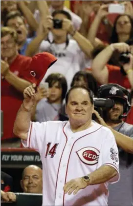  ?? THE ASSOCIATED PRESS FILE ?? Pete Rose takes a bow during ceremonies honoring the starting eight of the 1975-76 world champion Cincinnati Reds following a game between the Reds and the Los Angeles Dodgers in Cincinnati in 2015. Rose is alleged to have carried on a sexual...