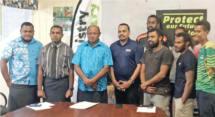  ?? The handover in Lautoka. ?? Minister of Forestry Osea Naiqamu (centre) , Coronation Church Youth Leader Kevueli Nasedra and Dayals Sawmillers Ltd Director Praneel Dayal after