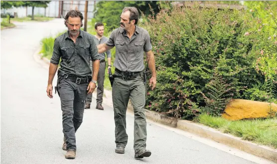  ??  ?? Andrew Lincoln’s character Rick and his hero crew on The Walking Dead have a host of new villains to deal with this season, including Calgary born Steven Ogg’s scene-stealing Simon, right.