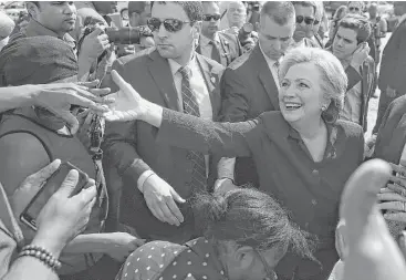  ?? Justin Sullivan / Getty Images ?? Democratic nominee Hillary Clinton greeted voters last week at an early voting site in Lauderhill, Fla.