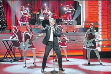  ?? Kevin Parry ?? REX SMITH channels actor Bill Nighy channeling aging rocker Billy Mack in “Love Actually Live.”