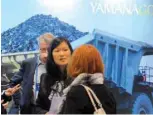  ?? — Reuters ?? Visitors to the Yamana Gold mining company booth speak with representa­tives during the Prospector­s and Developers Associatio­n of Canada annual convention in Toronto, Canada.