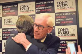  ?? MILWAUKEE JOURNAL SENTINEL MAX BAYER / ?? State schools Superinten­dent Tony Evers hugs a supporter before making his victory speech at the Park Hotel in Madison Tuesday night. Evers will face Gov. Scott Walker in the Nov. 6 election.