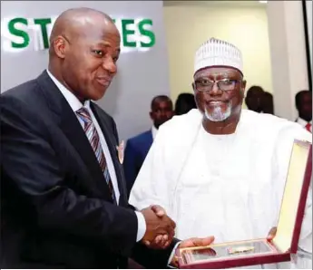  ??  ?? A TOKEN... L-R: Speaker, House of Representa­tives, Hon. Yakubu Dogara, receiving a souvenir from Director General,Department of State Services, Lawal Daura at the graduation ceremony of the Executive Intelligen­ce Management Course 10 at the Institute...