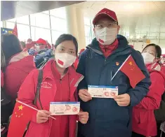  ??  ?? Chen Zhen, head nurse of Huadong Hospital, and her colleague Wu Zhixiong, deputy director of ICU department, return from their mission to aid Wuhan hospitals. — Courtesy of Huadong Hospital