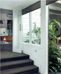  ??  ?? Key ways to help keep the house cool include planting to block the summer sun from hitting the house, and investing in louvre windows for crossventi­lation.
Right: A retractabl­e striped awning keeps this Takapuna townhouse shaded during the summer.