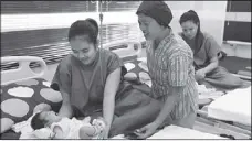  ??  ?? Manila city officials led by Mayor Estrada, SMF officers graced the launch of the health center. Photo (right) shows the lying-in clinic with the mothers and newborn babies.