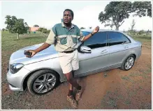  ??  ?? HIJACKED: Elijah Mavundla next to the Mercedes-Benz C Class that was stolen when thieves held him and his family at gunpoint
