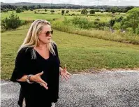  ??  ?? Toni Lott stands near property off Texas 46 between Boerne and Bergheim where a company seeks to build a batch plant.