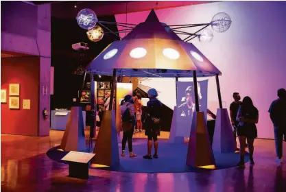  ?? Odell Hussey Photograph­y photos ?? A replica of Parliament Funkadelic’s iconic stage prop, the Mothership, is part of the exhibit.