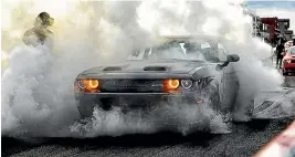  ??  ?? A Dodge Challenger celebrates claiming the top spot for the first time in the survey’s 34-year history.