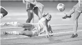  ?? MICHAEL LAUGHLIN/STAFF PHOTOGRAPH­ER ?? Boca Raton’s Stephanie Dodson dives for the ball during the Class 5A state semifinal against Miami Lourdes Academy on Friday night.