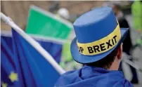  ?? Reuters ?? an anti-Brexit protestor’s hat displays the words ‘stop Brexit’ as he stands outside the houses of Parliament in london. —