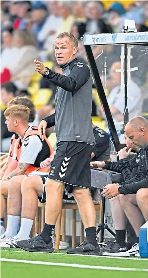  ?? ?? New Hearts boss Wouter Vrancken passes on instructio­ns to his players.