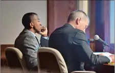  ?? TIM MARTIN/THE DAY ?? Defendant Dante A. Hughes, left, looks on with his attorney, Walter D. Hussey, during the first day of testimony Wednesday.