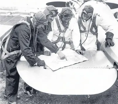  ??  ?? Left: pilots of 111 Squadron taking part in air exercises in 1935, using the tail plane of a Bristol Bulldog fighter to plot their route on a map. Right: No 19 Fighter Squadron, based at Duxford, Cambridges­hire, flying their two-blade propeller...