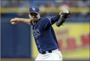  ?? CHRIS O’MEARA — THE ASSOCIATED PRESS ?? The Rays’ Charlie Morton goes into his delivery to the Red Sox during the first inning of a baseball game July 24 in St. Petersburg, Fla.