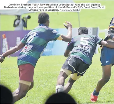 ?? Picture: ATU RASEA ?? Dominion Brothers Youth forward Akuila Vodotagita­gi runs the ball against Barbarians during the youth competitio­n of the McDonald’s Fiji’s Coral Coast 7s at Lawaqa Park in Sigatoka.