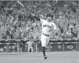  ?? DAVID J. PHILLIP/AP ?? The Astros’ Jose Altuve celebrates after hitting a home run against the Yankees during the fifth inning of Game 7 of the ALCS on Saturday in Houston.