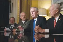  ?? TOM BRENNER / THE NEW YORK TIMES ?? Senate Majority Leader Mitch Mcconnell, R-KY., speaks Thursday before a meeting on tax reform legislatio­n on Capitol Hill. In both the House and Senate, Republican leaders are shopping for economic analyses that support their contention that their...