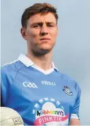  ??  ?? John Small with the charity logo that will appear on the Dublin jersey