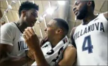  ?? LAURENCE KESTERSON — THE ASSOCIATED PRESS ?? Villanova’s Phil Booth (5) center, laughs with Saddiq Bey, left, and forward Eric Paschall (4) after beating Morgan State 100-77.