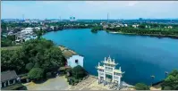  ?? PHOTOS PROVIDED TO CHINA DAILY ?? From left: The Jinggang ancient town in Wangcheng district is a tourist attraction on the west bank of the Xiangjiang River. A view of the Wangcheng Tongguan Kiln ancient town.