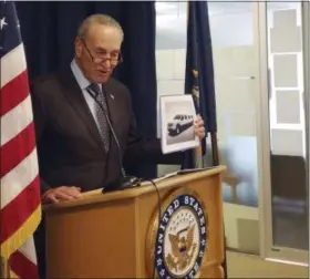  ?? JULIE WALKER — THE ASSOCIATED PRESS ?? Sen. Chuck Schumer, D-NY, holds a photo of a stretch limousine during a news conference in New York on Sunday.