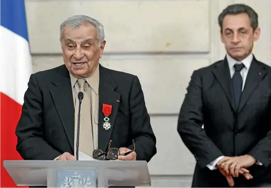  ?? AP ?? Arsene Tchakarian with former French president Nicolas Sarkozy in 2012, when he was made an officer of the French Legion of Honour. The award was upgraded to commander in 2017, and current president Emmanuel Macron commemorat­ed him as ‘‘a hero of the resistance’’.