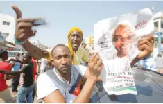  ?? — Reuters ?? Supporters of president-elect Adama Barrow celebrate Barrow’s election victory in Banjul.