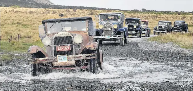  ?? PHOTO: STEPHEN JAQUIERY ?? Built to last . . . John Wilson, of Christchur­ch, splashes his 1929 Ford A through a creek on the Mavora Lakes road. One hundred and fifty cars journeyed from Te Anau to Walter Peak station yesterday during the 14th National Model A rally.