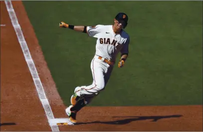 ?? NHAT V. MEYER — BAY AREA NEWS GROUP ?? The Giants’ Mauricio Dubon rounds first base after hitting a solo home run against the San Diego Padres last season.